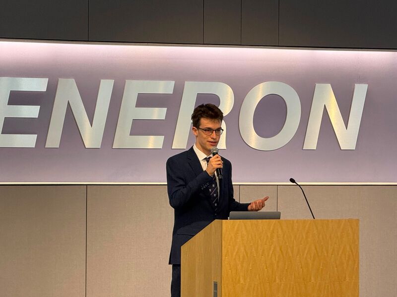 Tomas Jones speaking at a podium